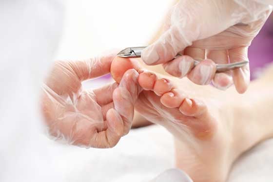 Podiatrist treating a patient's foot